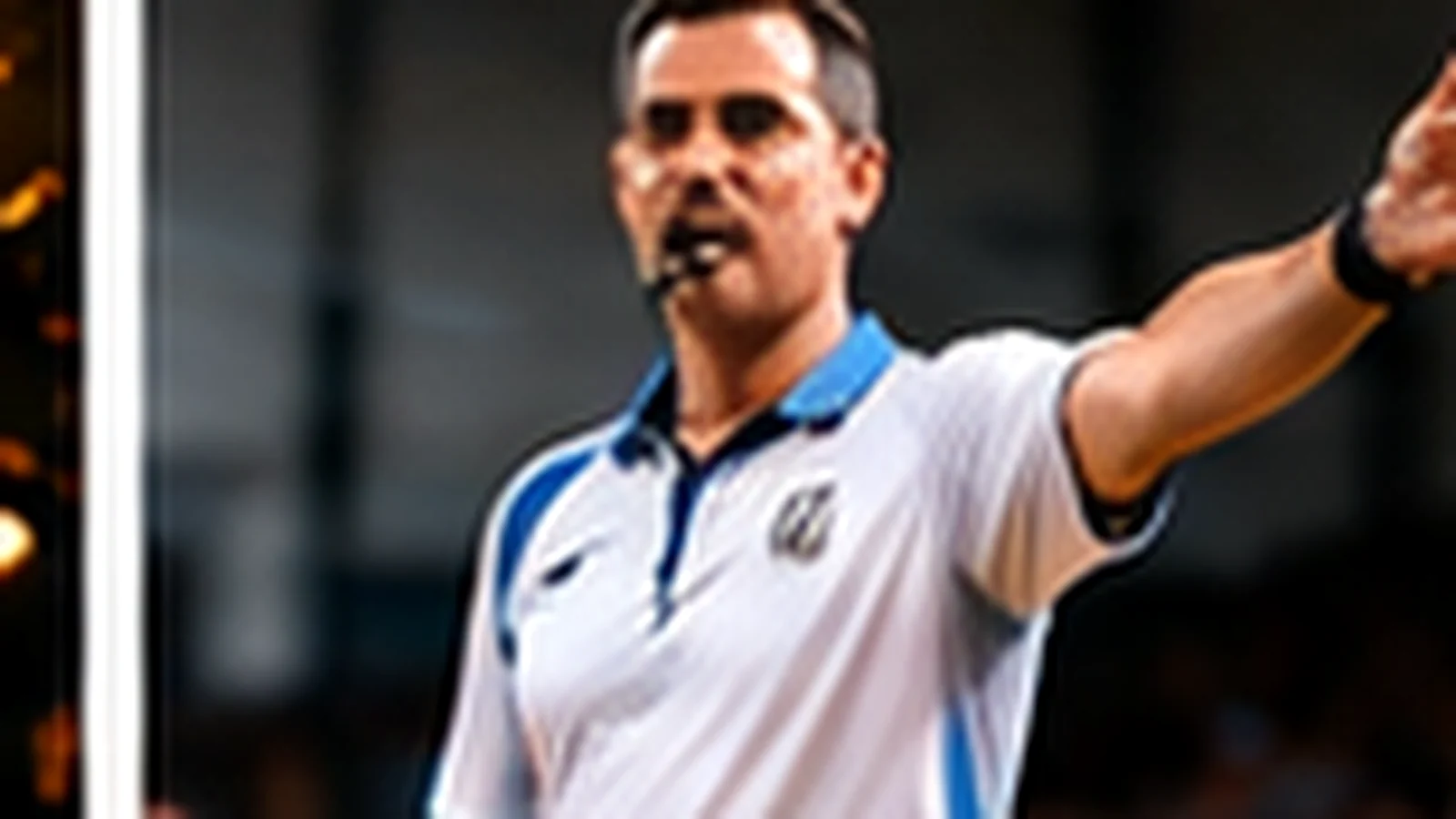 A volleyball referee officiating a match