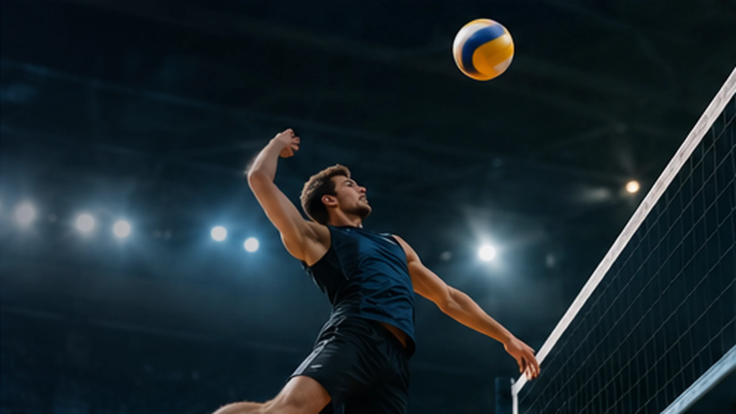 A volleyball player spiking the ball during an indoor match
